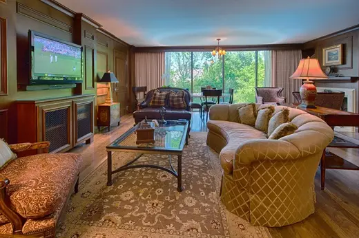 Cozy living room with large windows at J. Flowers Health Institute, a detox center in Houston.