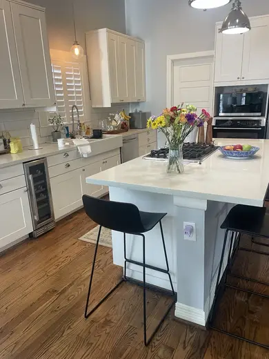 Modern kitchen with island at Hope House by Winds of Change, a sober living home in Houston.