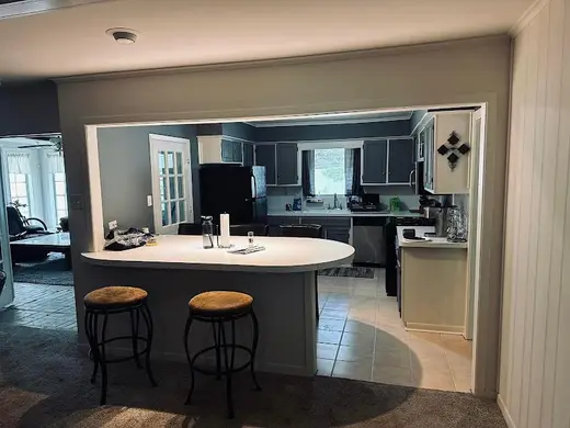 Modern kitchen with island at Houston Recovery Houses LLC, a sober living home in Houston.