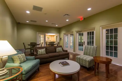 Cozy shared living room with modern decor at Nora's Home, a sober living home in Houston.