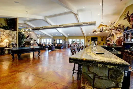 Spacious lounge area with bar in a treatment center in Houston.