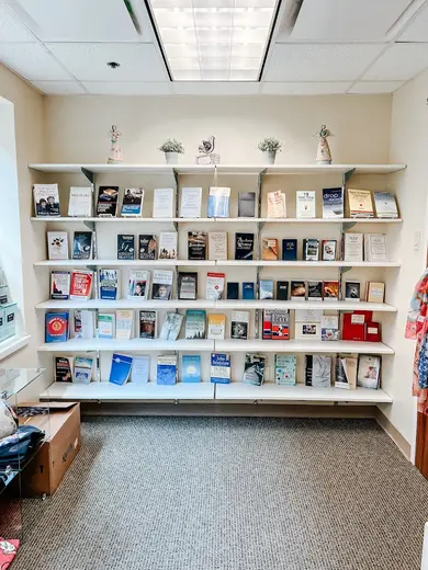 Bookshelf filled with various titles in a treatment center in Houston.